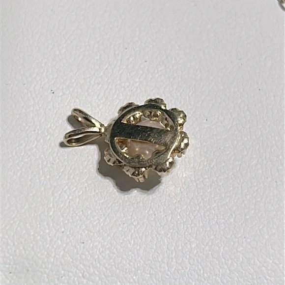 14k, cultured pearl and single cut diamond pendant .08 carat total weight .8 g
